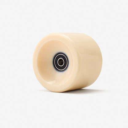 Beige wheel with a central bearing on a white background